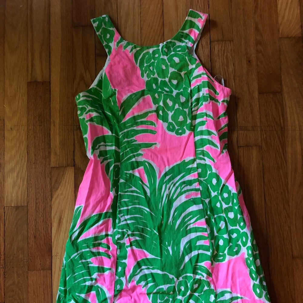 Please note slight ink stains on right side of dress where arm falls
